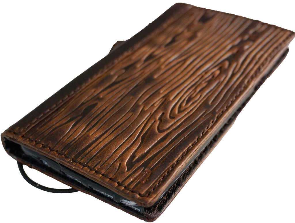 Handmade genuine leather phone case by DAVISCASE for iPhone 17, 16, 12, 13, 14, 15 Pro Max, featuring shark wood style and card slots.