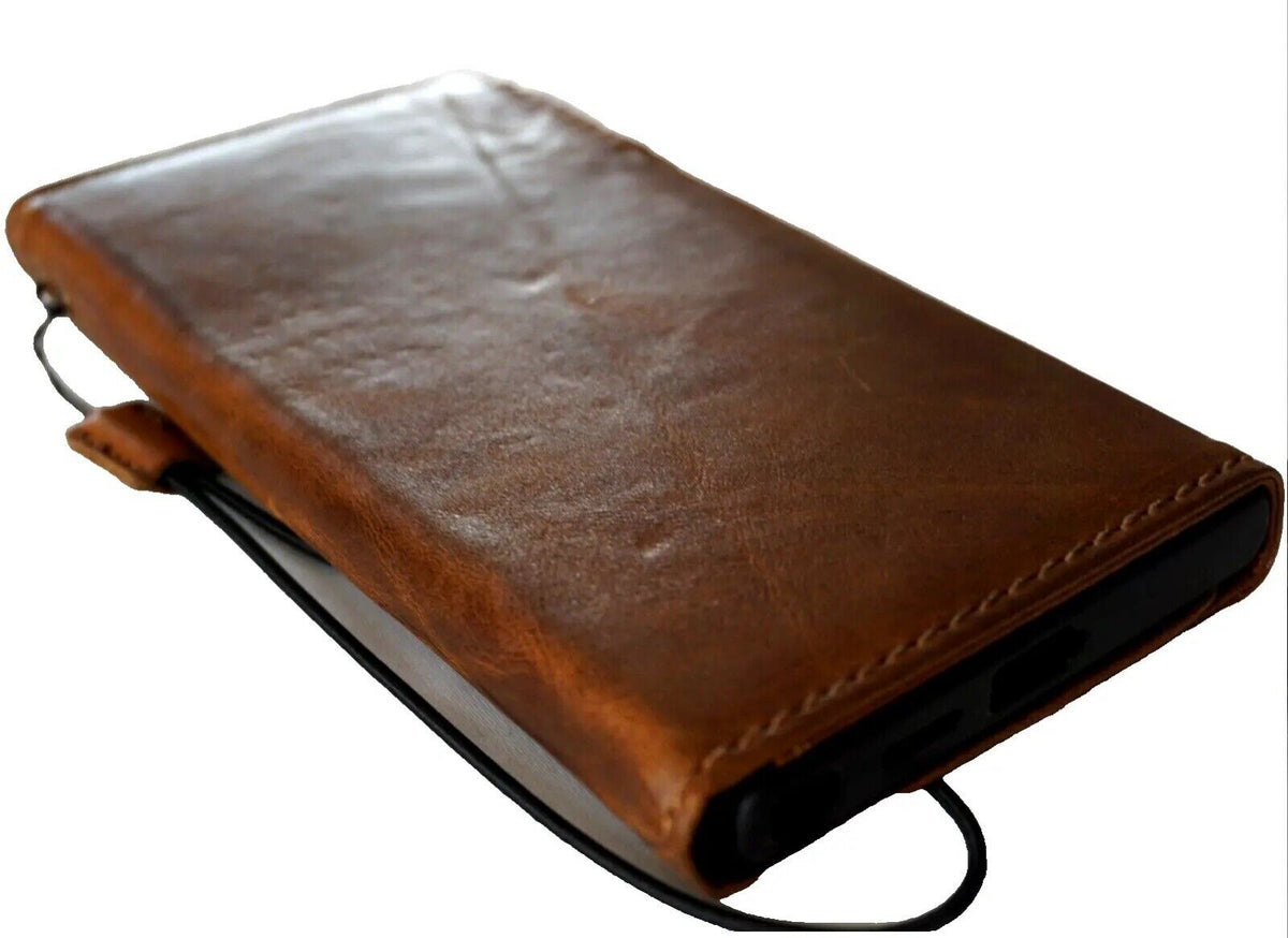Handmade genuine leather phone case for Samsung Galaxy S24 Ultra, with magnetic closure and rubber holder in tan color.