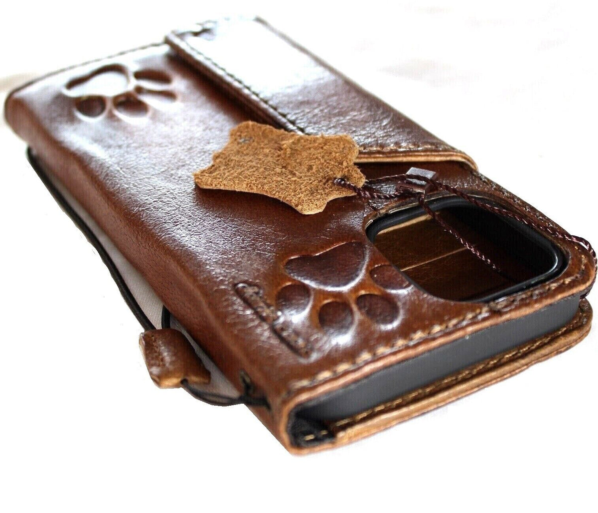 Handmade DAVISCASE genuine leather phone case with wallet design for iPhone 11 to 16 Pro Max, featuring a magnetic dog paw detail.