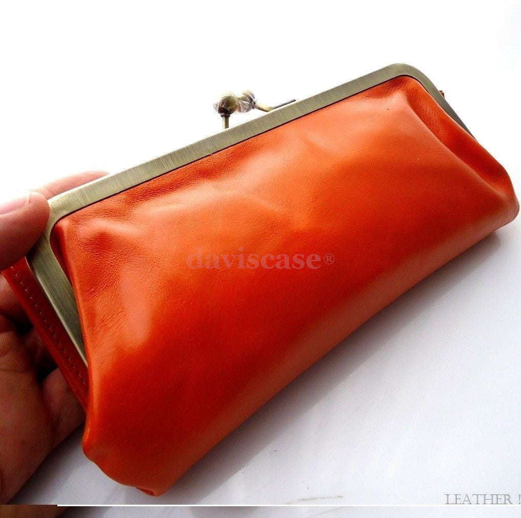 Orange genuine leather women's wallet by DAVISCASE with card slots, coin pocket, and clutch design.