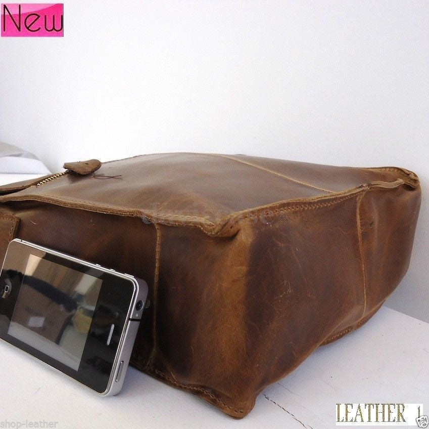 Men's vintage leather messenger bag with handles, designed for iPad and laptops, in classic brown leather.