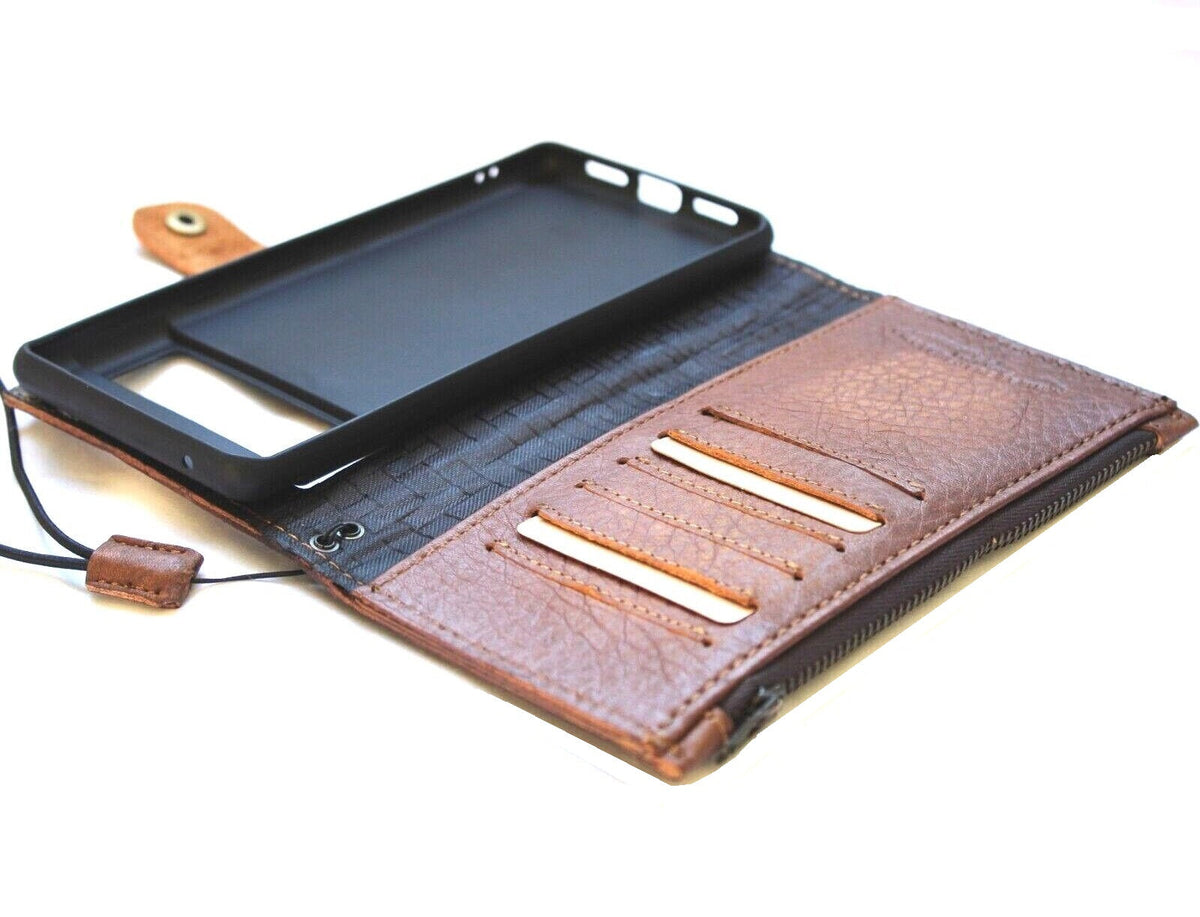 Genuine leather Google Pixel 7 Pro case by DAVISCASE with wallet design, stand feature, zip closure, and embedded decorative elements.