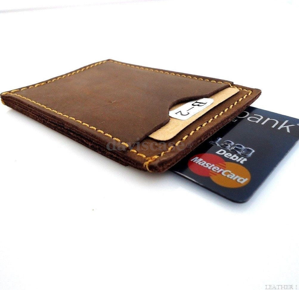 Genuine leather men's mini wallet with ID and credit card slots, compact pocket-sized design for cash and cards.