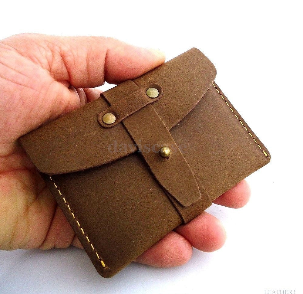 Genuine leather men's mini wallet with card slots and ID window, compact money and credit card holder in black.