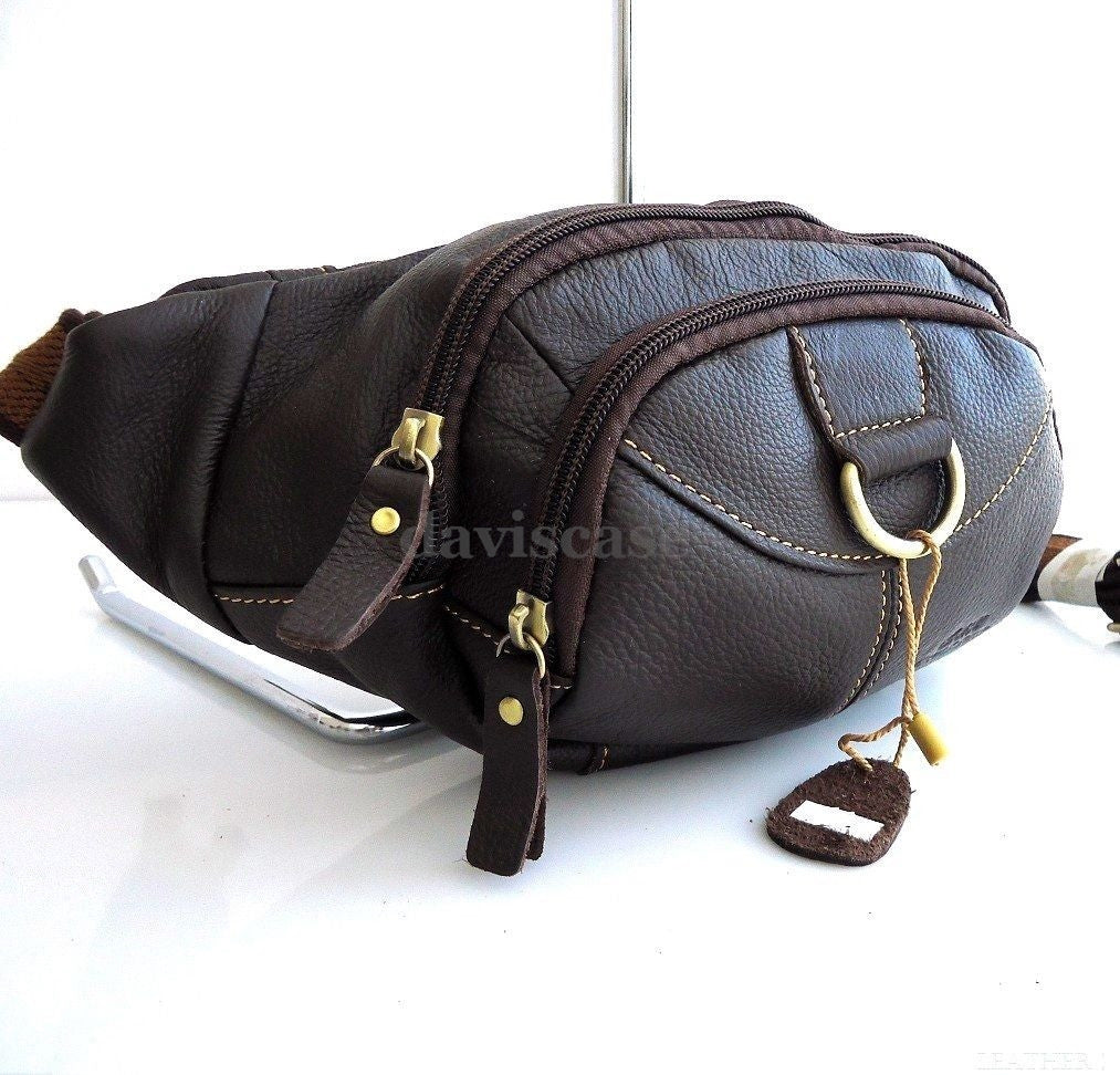 Men's genuine leather wallet bag with zipper, waist pouch, and sling design, suitable for carrying a cellphone and essentials.