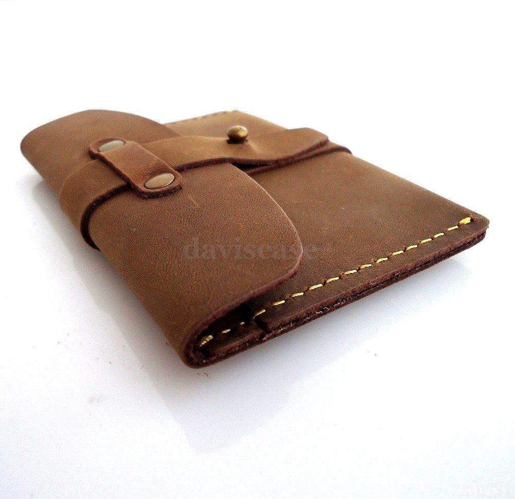 Genuine leather men's mini wallet with card slots and coin pocket, compact and slim design for cash and ID storage.