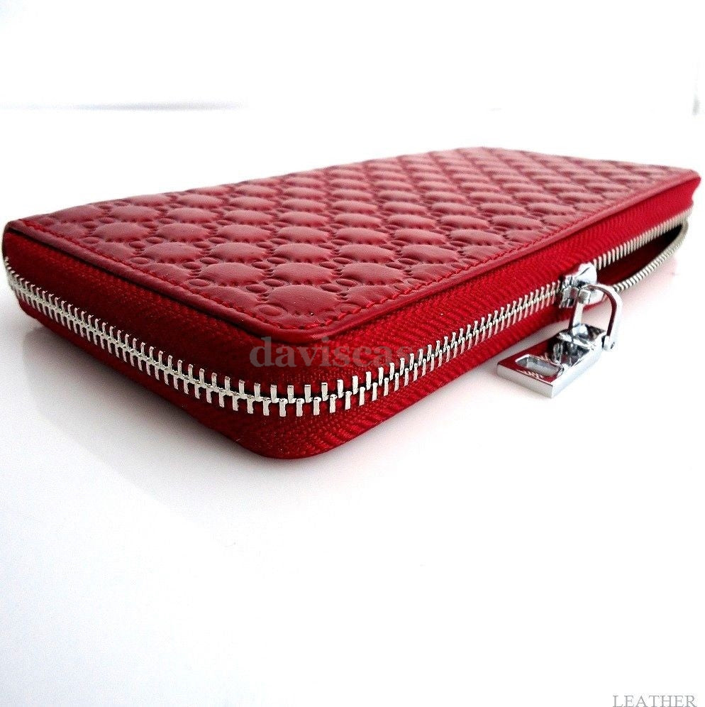 Women's genuine leather wallet and clutch purse with bowknot design, featuring zip closure, card slots, and bifold style.