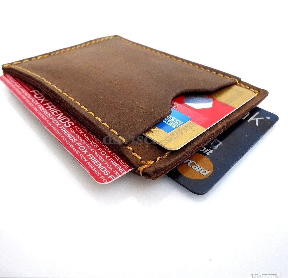 Genuine leather men's mini wallet with card slots and ID window, compact and slim for easy carry and everyday use.