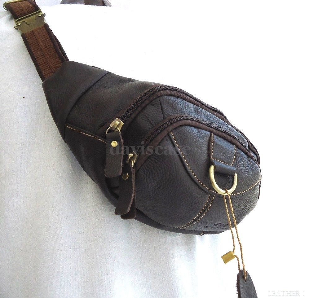 Men's genuine leather wallet bag with zipper, waist pouch, and sling strap, suitable for carrying a cellphone and essentials.
