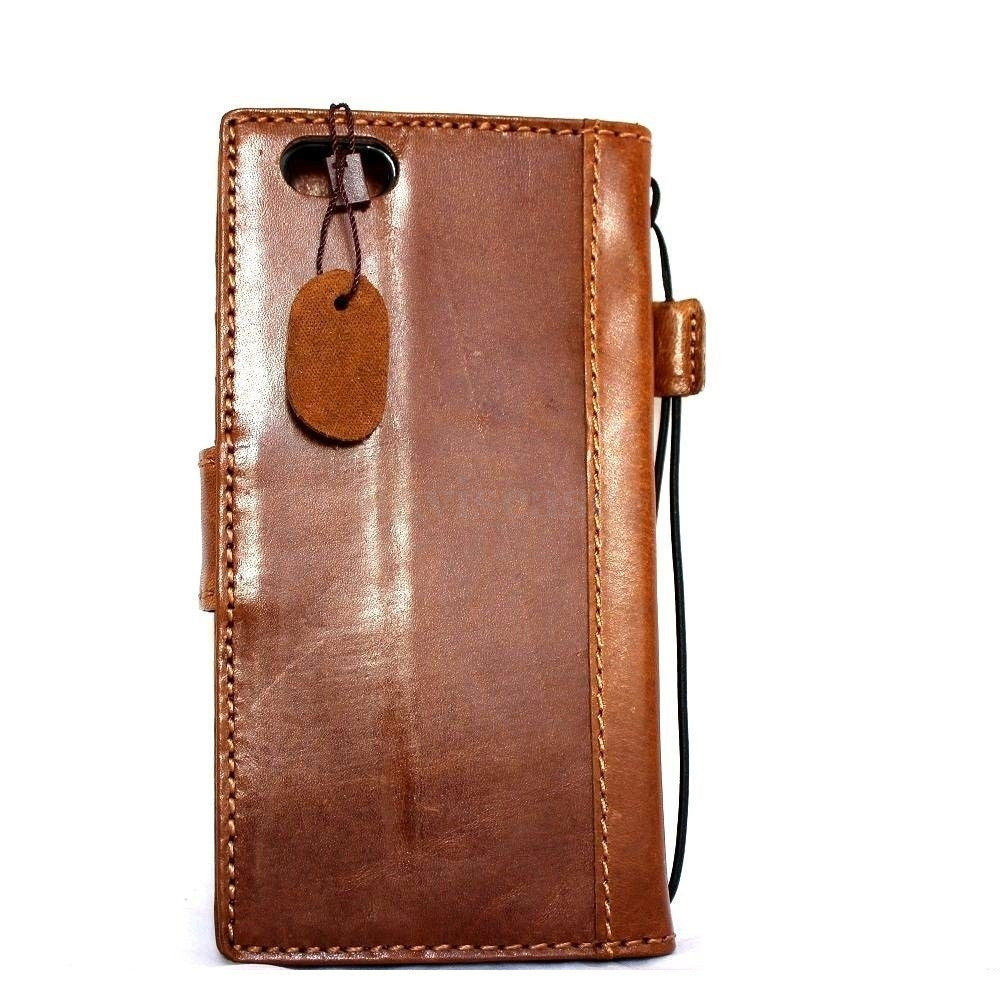 Handmade genuine leather iPhone 6 Plus case with wallet features, credit card slots, ID window, and magnetic closure.