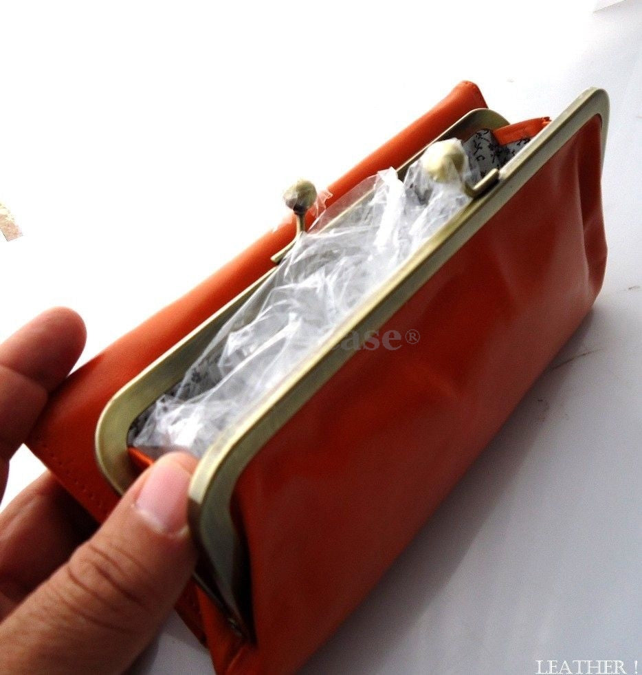 Orange genuine leather women's wallet with card slots, coin pouch, and clutch design by DAVISCASE.