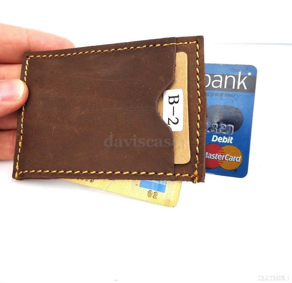 Genuine leather men's mini wallet with ID and credit card slots, compact pocket design, vendor-unknown brand.
