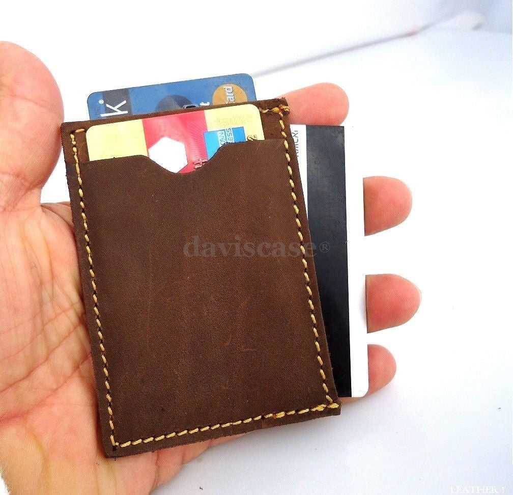 Genuine leather men's mini wallet with ID and credit card slots, compact pocket design, vendor-unknown brand.