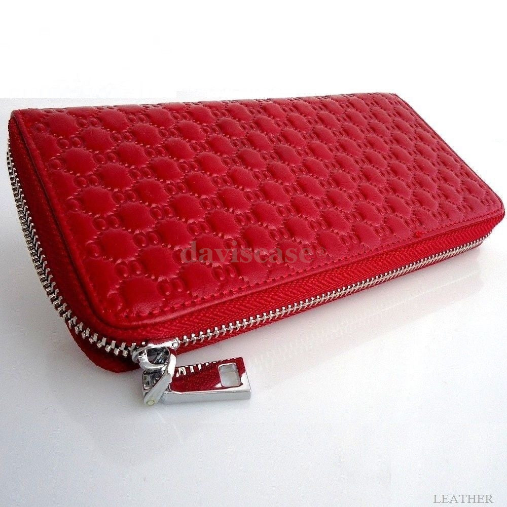 Genuine leather women's wallet and clutch purse with bowknot design, button closure, zip case, and bifold style for fashionable use.