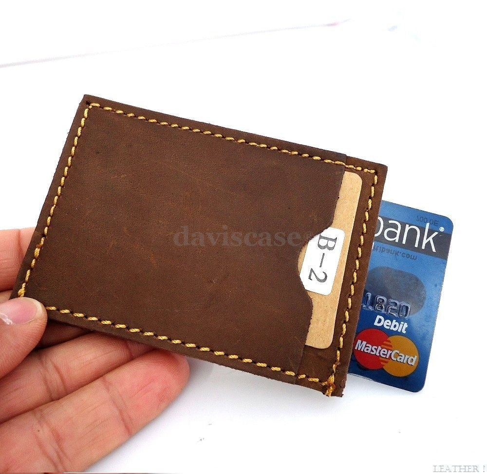 Genuine leather men's mini wallet with ID and credit card slots, compact pocket design, slim leather money holder.