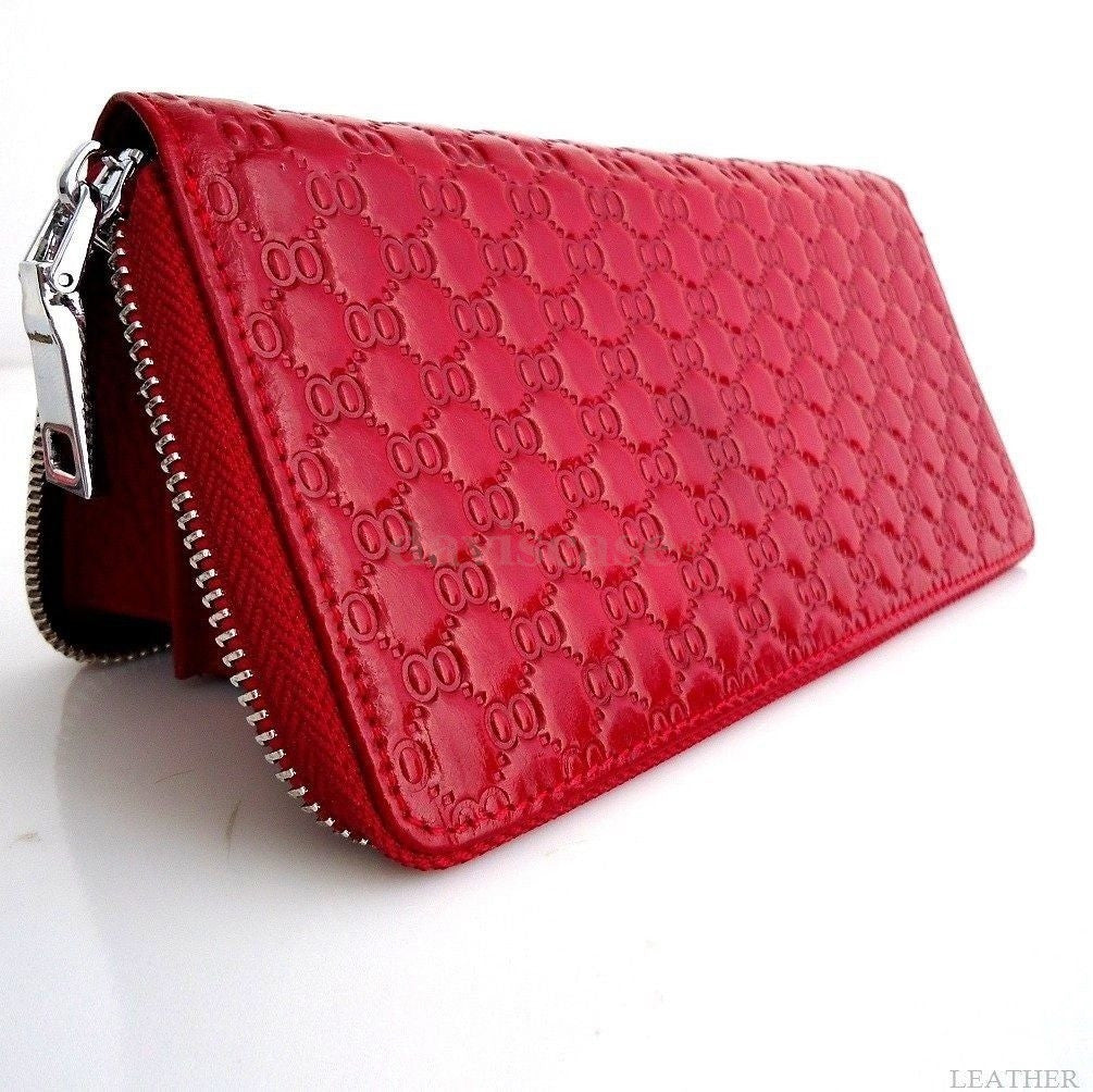 Genuine leather women's wallet and clutch purse with bowknot design, zip case, bifold style, and card slots in black.