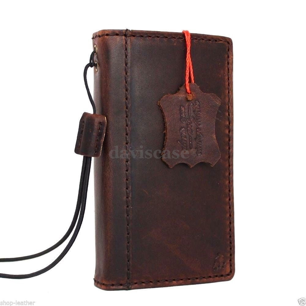 Handmade genuine Italian leather iPhone 4S case with book wallet stand feature, crafted for stylish protection and functionality.