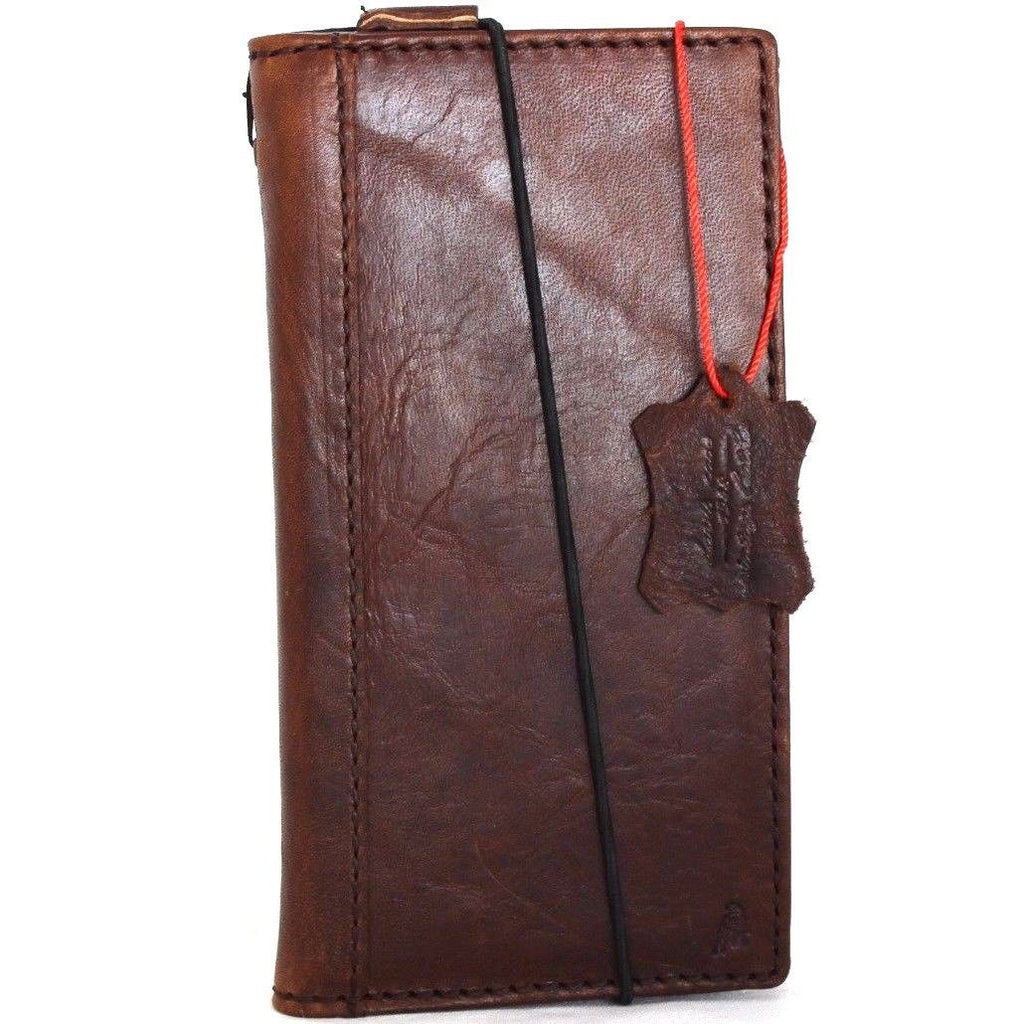 Genuine full leather iPhone 8 case with wallet design, elastic strap, and space for cards, compatible with wireless charging.