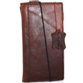 Genuine full leather iPhone 8 case with wallet design, elastic strap, and space for cards, compatible with wireless charging.