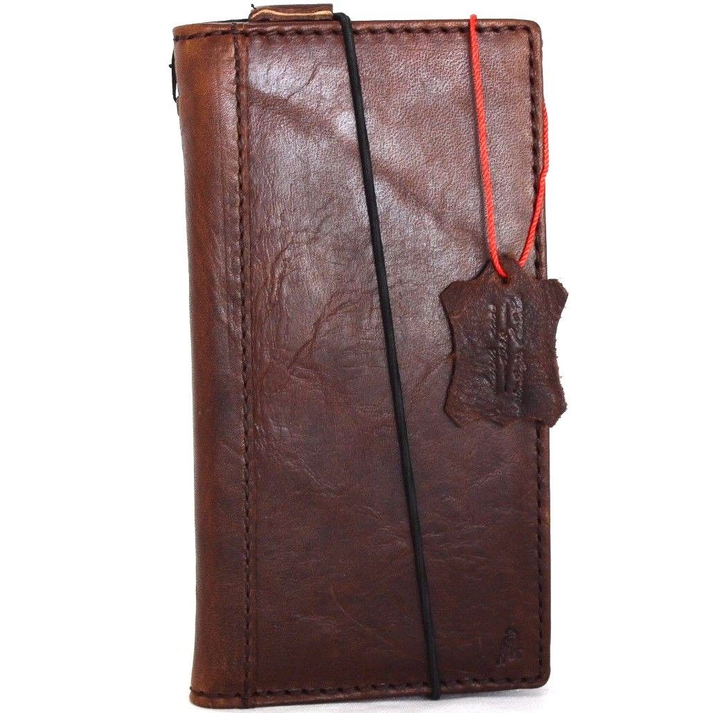 Genuine full leather iPhone 8 case with wallet design, elastic strap, and space for cards, compatible with wireless charging.