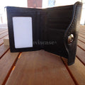 Men's black genuine leather money clip wallet with slim trifold design, by DAVISCASE, featuring a check pattern and compact clutch style.