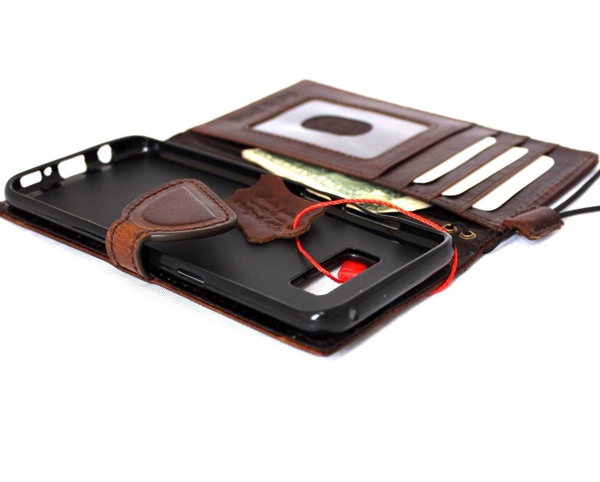 Handmade genuine leather wallet case for Samsung Galaxy S8 with magnetic closure, natural textured leather, and card slots.