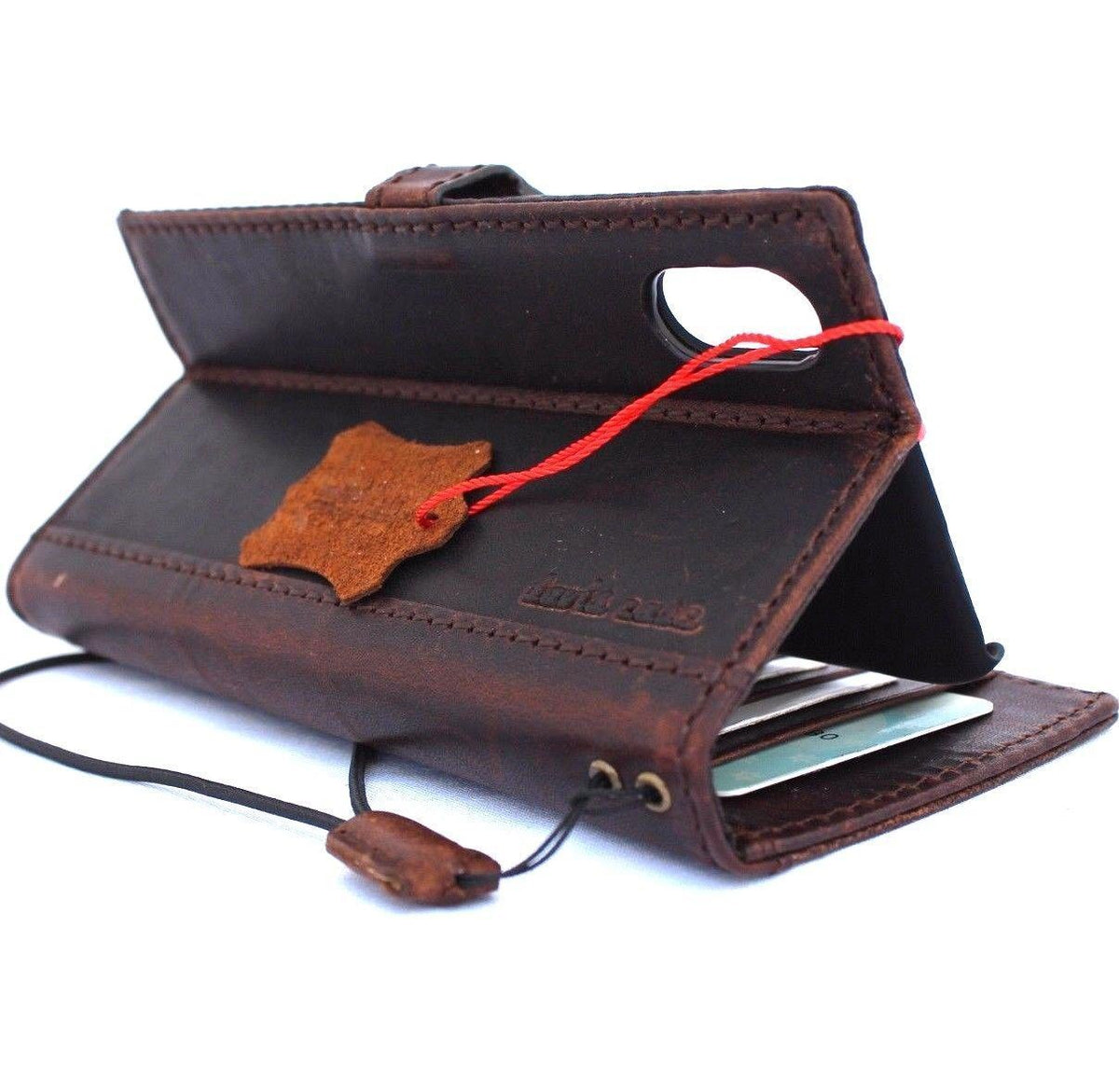 Handmade vintage brown leather iPhone X case with card slots and magnetic closure, designed as a slim book wallet by Daviscase D.