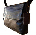 Vintage genuine leather men's laptop tote bag with travel style, suitable for 12 to 14-inch laptops, in a classic satchel design.
