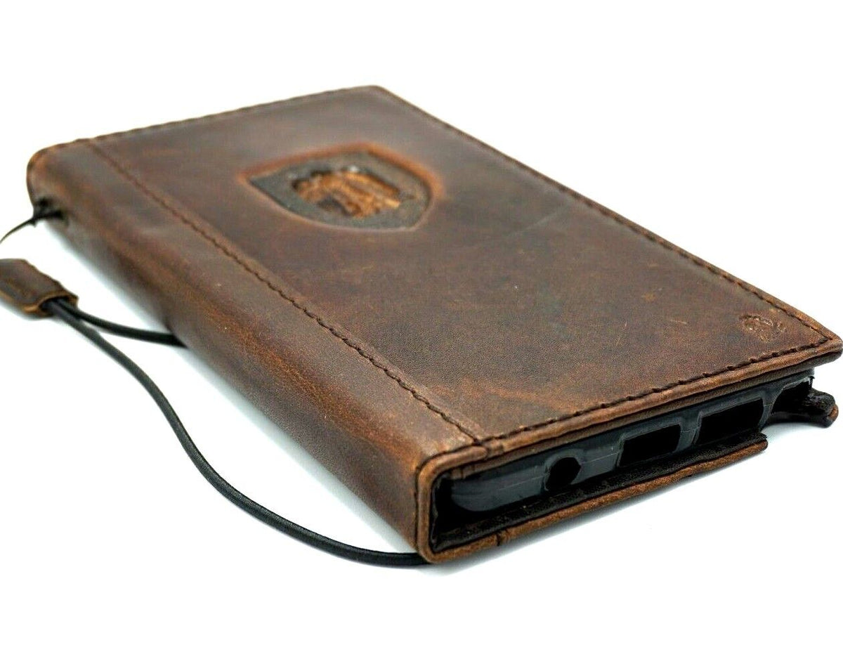 Handmade leather phone case by DAVISCASE for iPhone 12-16 Pro Max, 7-8 Plus, featuring eagle and falcon design, wallet style.