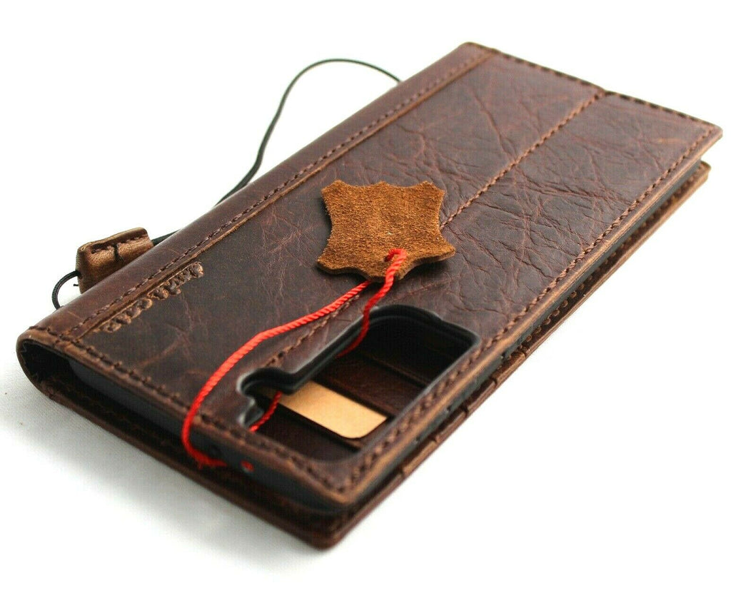 Genuine dark leather Galaxy S22 Plus 5G wallet case by DAVISCASE with ID window, card slots, and wireless charging compatibility.