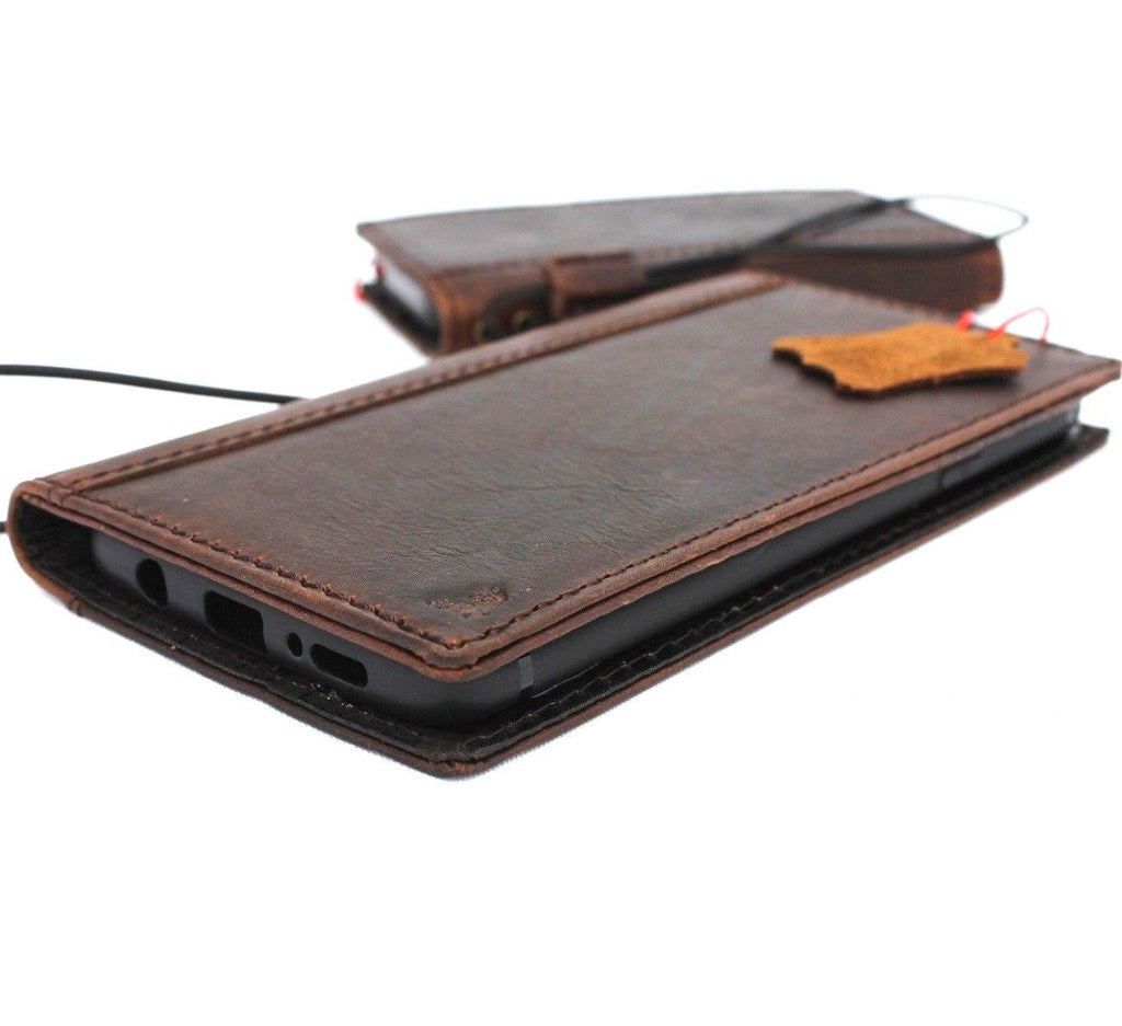 Vintage leather Samsung Galaxy S9 Plus wallet case with card slots, embossing, and ready for wireless charging.
