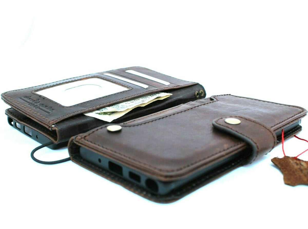 Genuine leather Samsung Galaxy Note 10 book wallet case with card slots, button closure, flip design, and rubber strap.