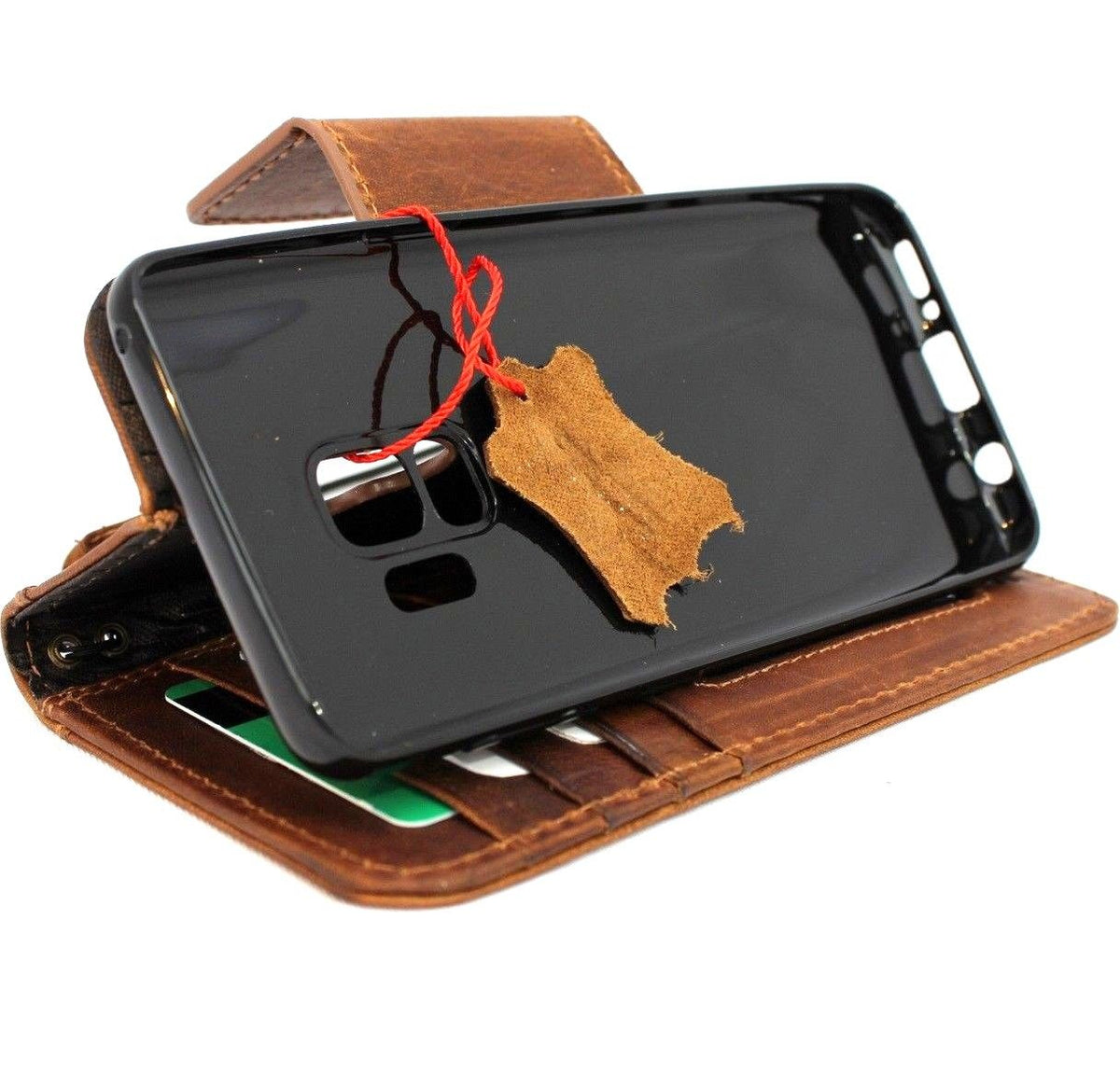 Handmade genuine leather wallet case for Samsung Galaxy S9 with magnetic cover, featuring natural leather texture and precise fit.