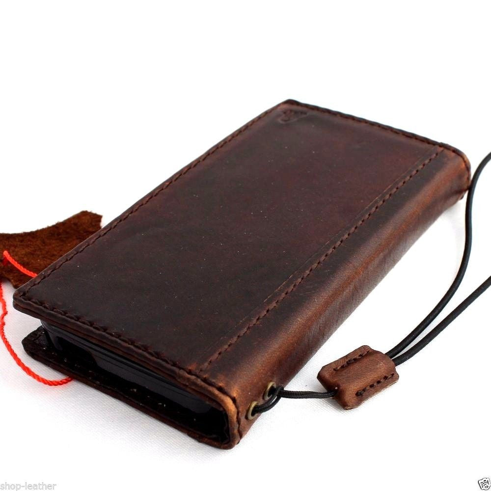 Handmade genuine leather flip cover for iPhone 5s, 5c, 5 with wallet card slots, by DAVISCASE, featuring a luxury book-style design.