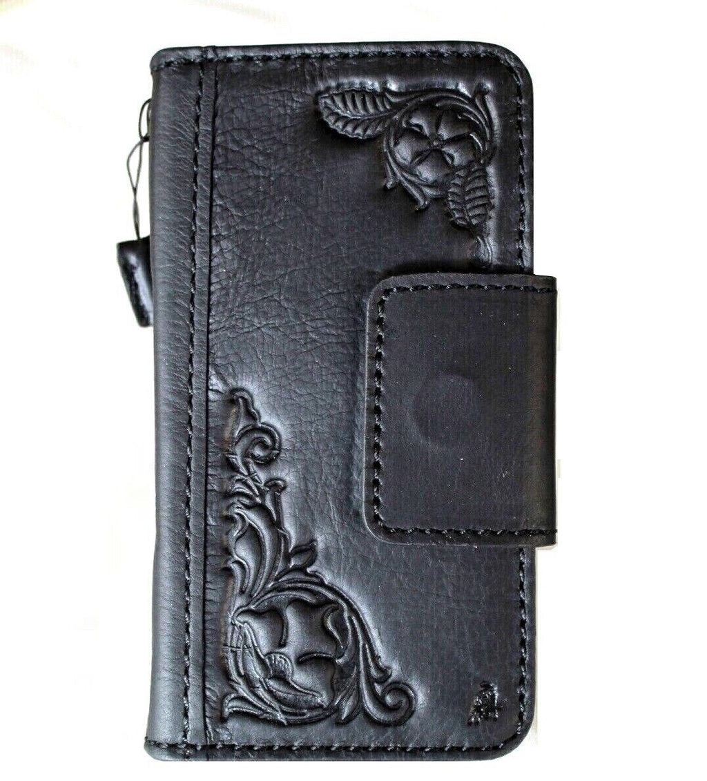 Black genuine leather Google Pixel 7 Pro case with magnetic closure, stand, and embedding decorations, designed for wireless charging.