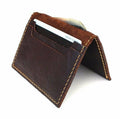 Men's DAVISCASE dark leather mini wallet with two card slots and slip pockets, showcasing a slim, soft leather credit card case.