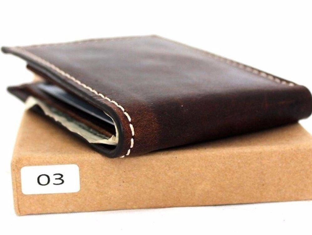 Men's brown leather bifold wallet with 4 credit card slots and 1 bill compartment, slim design for everyday use.