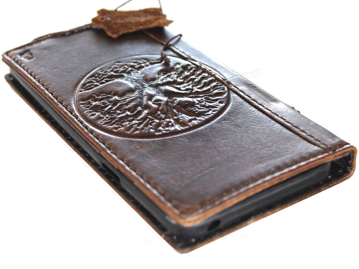 Genuine leather wallet case for Google Pixel 7 Pro by DAVISCASE with Tree of Life design, features stand and wireless charging compatibility.