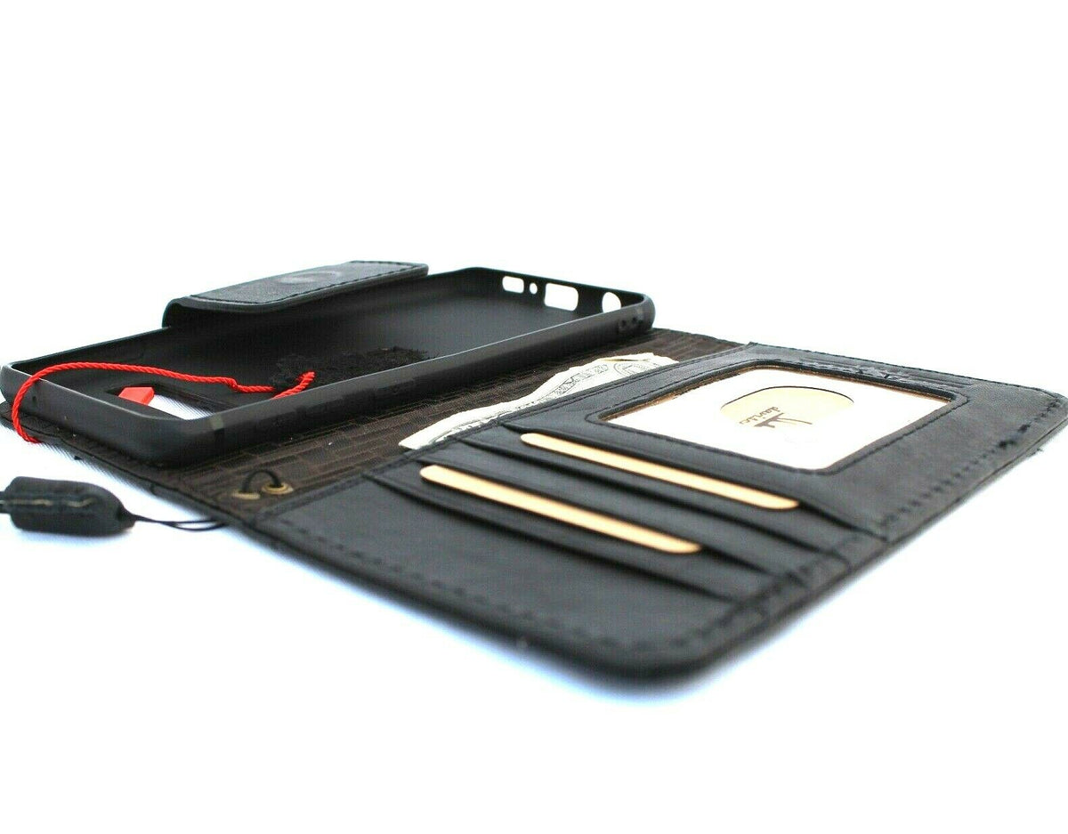 Black DAVISCASE genuine leather wallet case for Samsung Galaxy S10 with card slots and wireless charging holder.