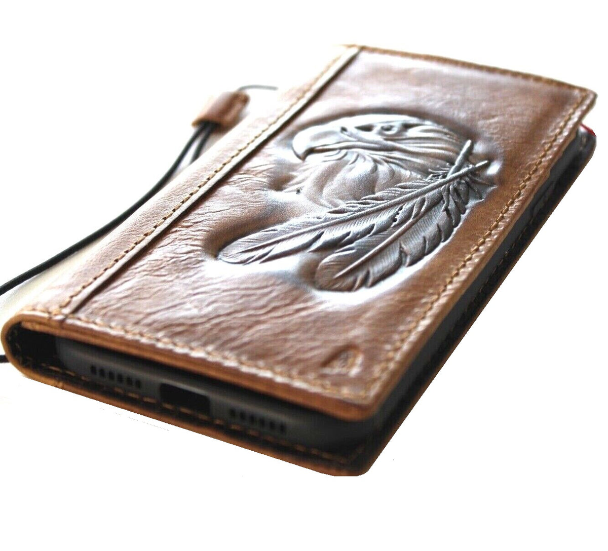 Handmade genuine leather phone case for iPhone 12 to 16 Pro Max by DAVISCASE, vintage tan leather with stamped eagle design.