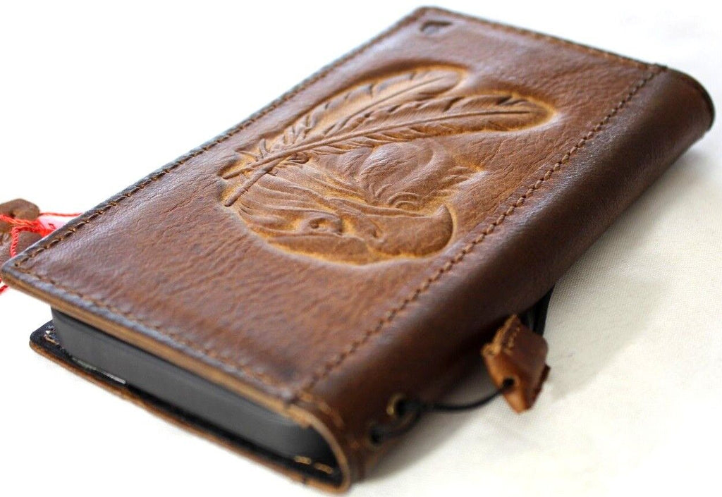Handmade vintage tan leather phone case for iPhone 13-18 Pro Max with card slots and eagle crafts falcon design by DAVISCASE.