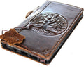 Handmade leather phone case for Apple iPhone 12-17 by DAVISCASE, featuring embossed Tree of Life design and compact wallet style.