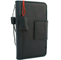 Black DAVISCASE genuine leather wallet case for Samsung Galaxy S10 with card slots, wireless charging holder, and magnetic closure.