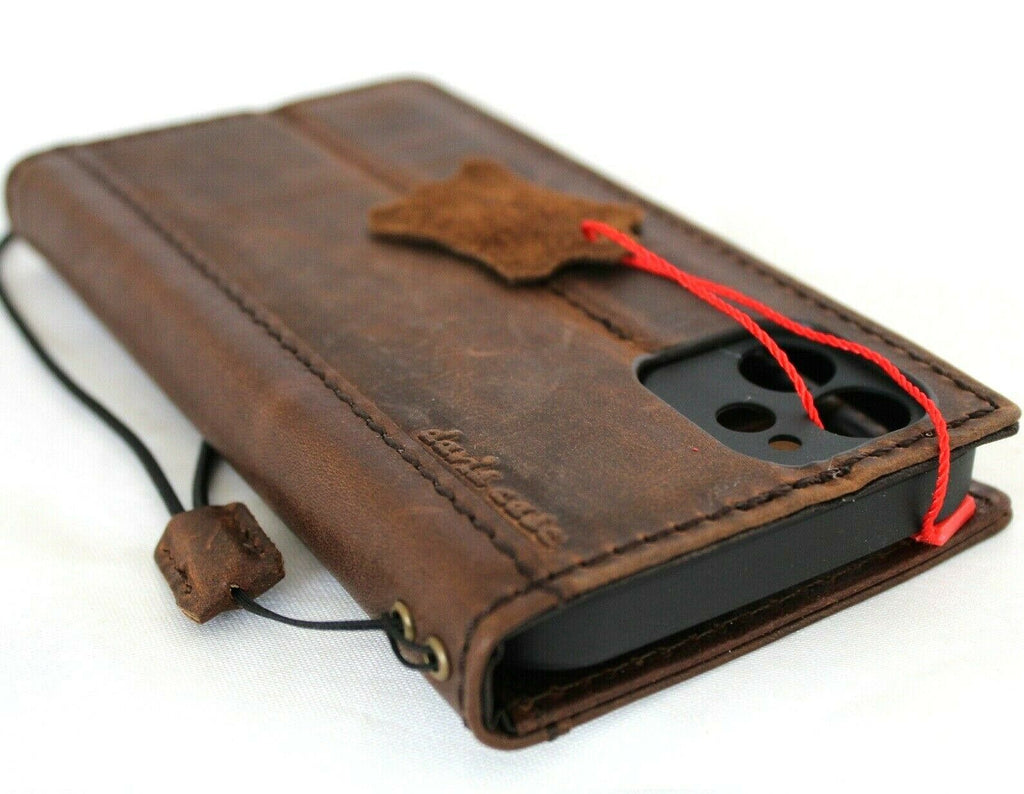 Genuine dark leather book-style wallet case for Apple iPhone 12 with credit card slots, handcrafted by DAVISCASE.