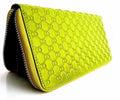 Green genuine leather women's purse and clutch tote with coin compartment, branded DAVISCASE, featuring a sleek, stylish design.