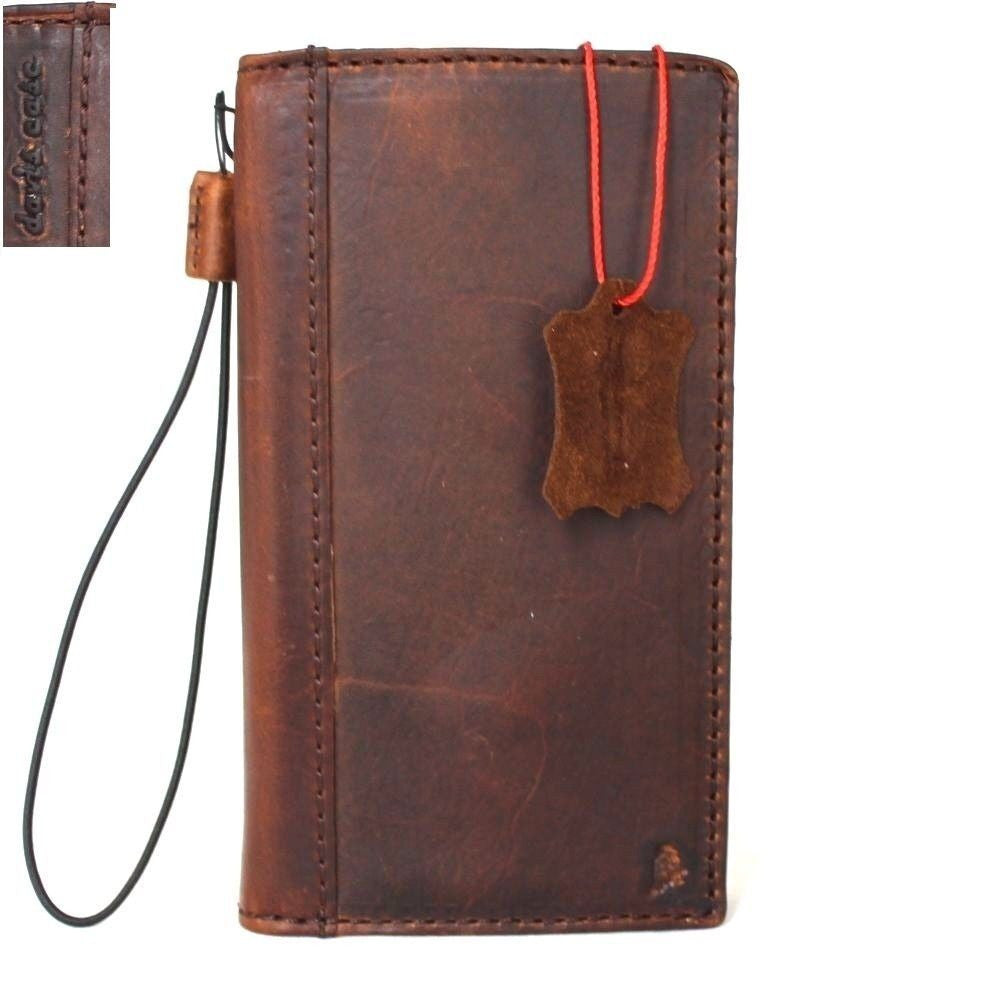 Handmade genuine leather phone case for Huawei P10 Plus, brown retro wallet style with card slots and slim design.