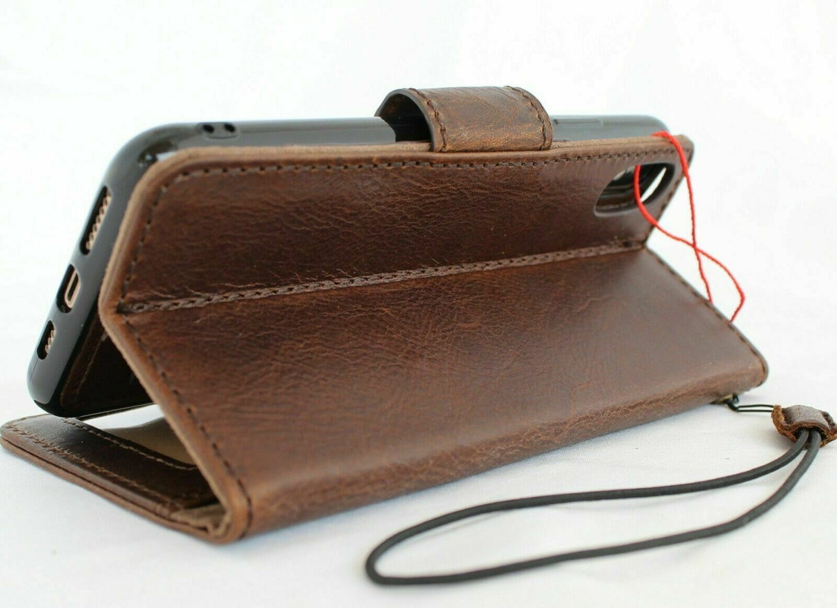 Dark genuine leather iPhone XS case by DAVISCASE with magnetic closure, wallet design, credit holder, and wireless charging compatibility.