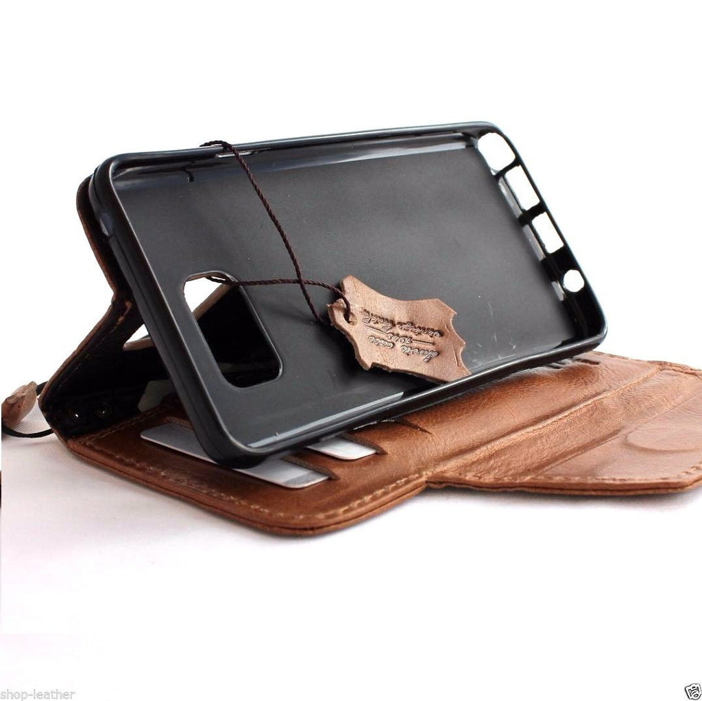 Light brown genuine leather Samsung Galaxy Note 5 wallet case with book style design and magnetic closure.
