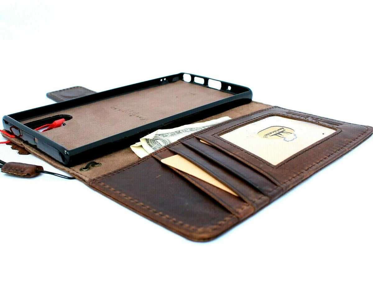 Dark brown genuine leather Samsung Galaxy Note 10 book wallet case with removable holder, slots, rubber stand, and magnetic closure.