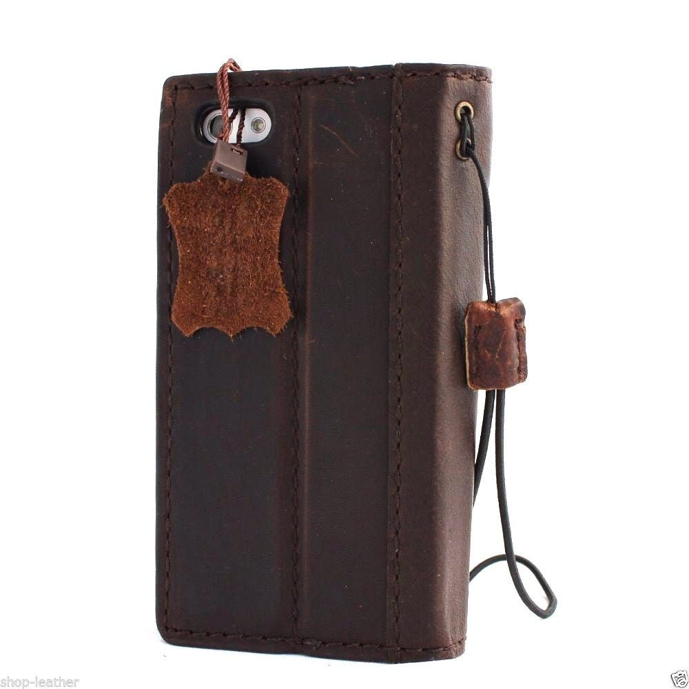 Handmade genuine leather flip case for iPhone 5s, 5c, 5 from DAVISCASE with wallet-style design and credit card slots.